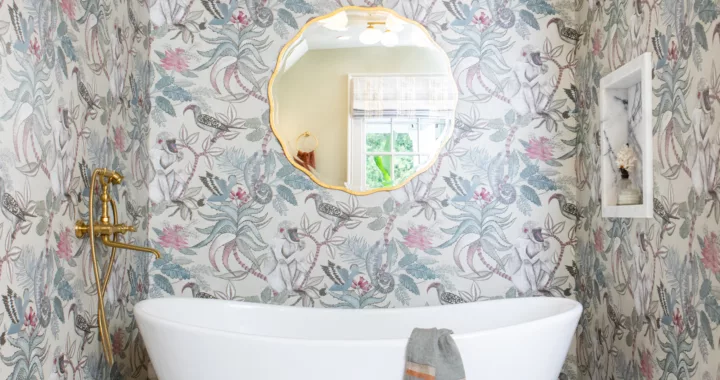 primary suite bathroom tub alcove soacking tub jungle wallpaper african lilac brass tub filler mosaic tile floor serene adventurous design