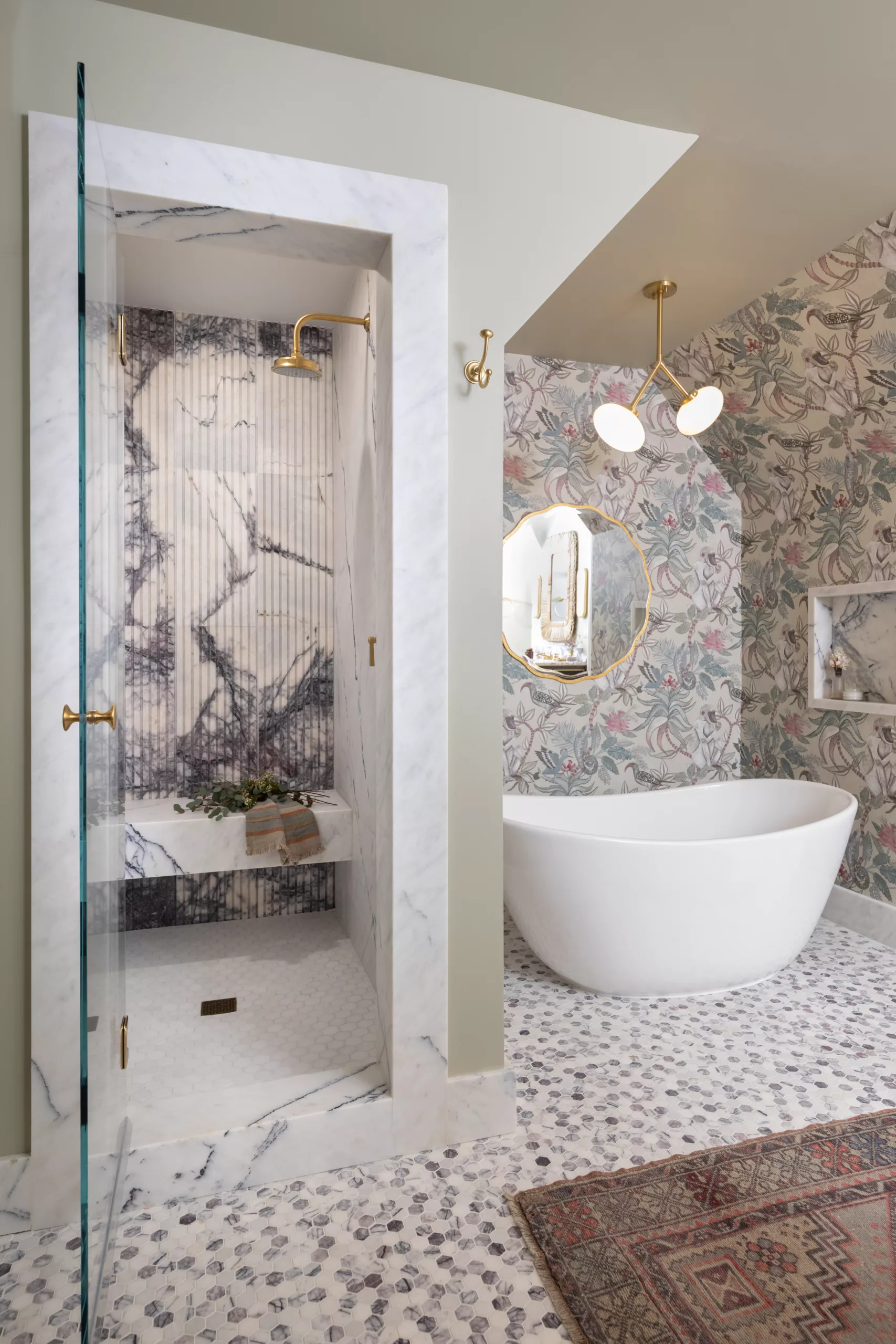 primary suite bathroom design lilac marble african jungle wallpaper soaking tub shower niche grooved marble
